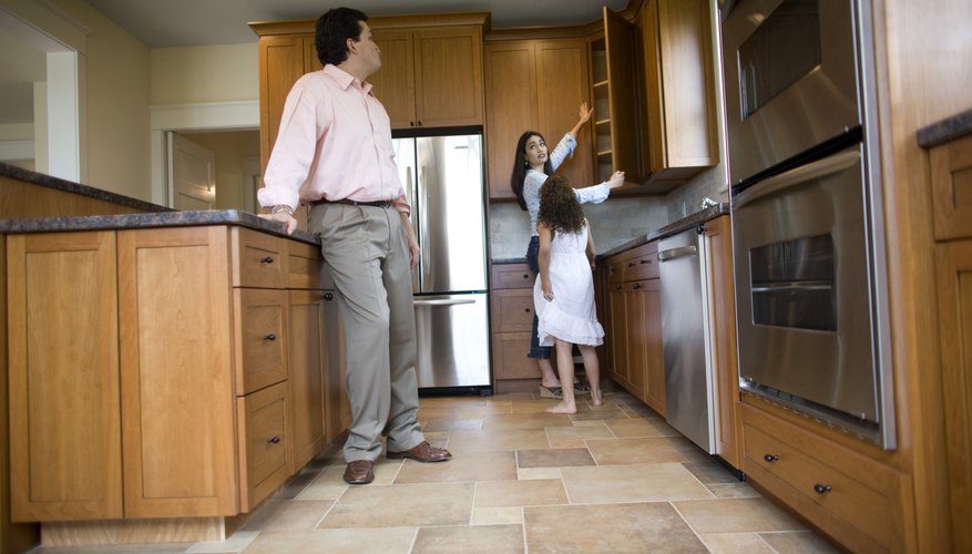 Family standing in kitchen. Family standing in kitchen.
