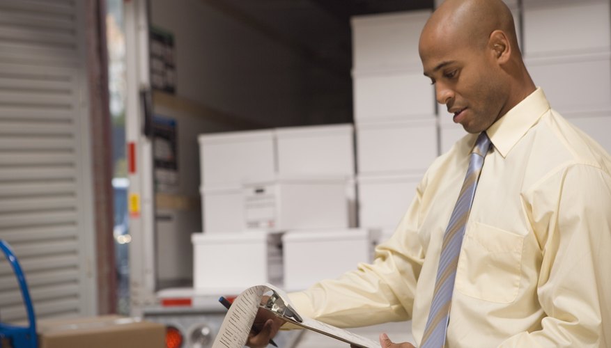 Man looking at inventory of delivery