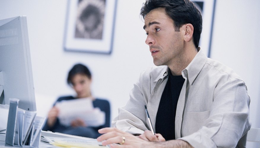 Frustrated man using computer