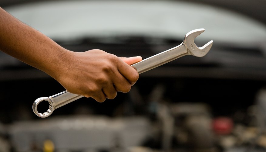 Hand holding wrench