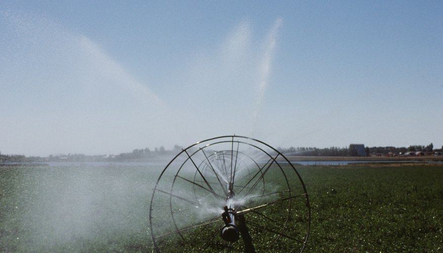 Photo Credit: Photos.com/Photos.com/Getty Images Sprinkler wheels are common in hay fields.