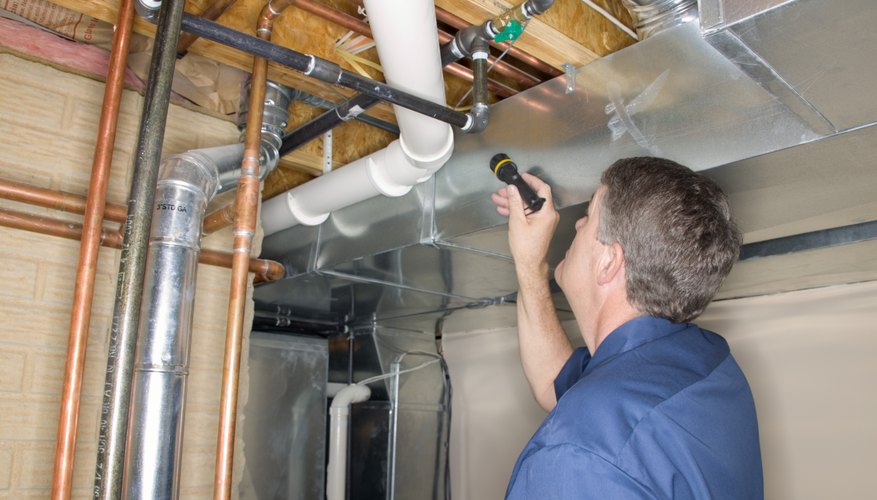 Inspecting pipes in a home. Inspecting pipes in a home.