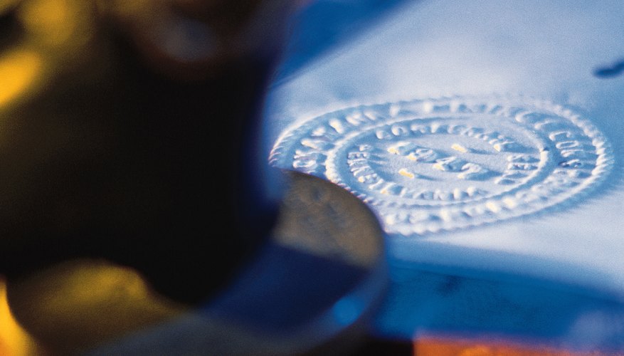 A notary uses a seal to certify a document.