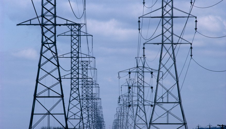 Two rows of electrical transmission lines and towers