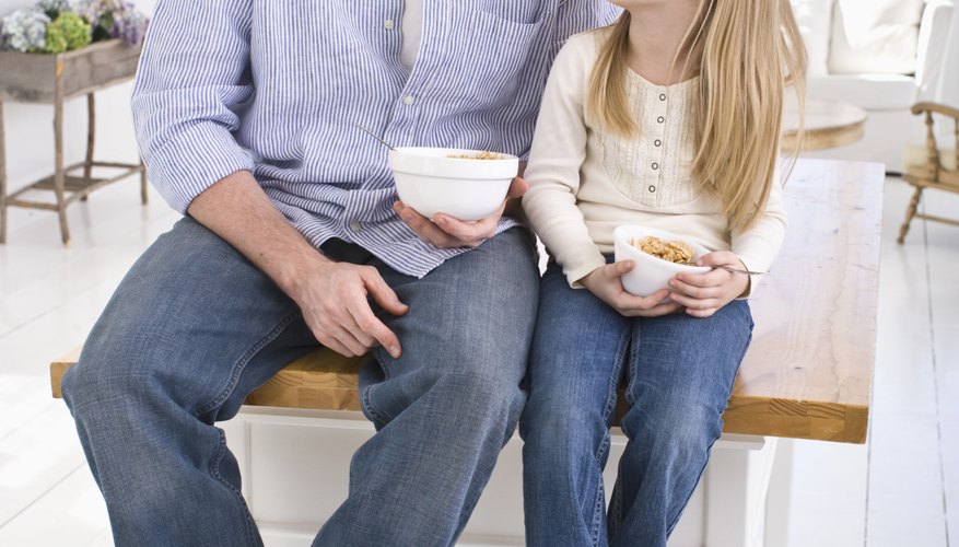 A parent having a discussion with his daughter. A parent having a discussion with his daughter.