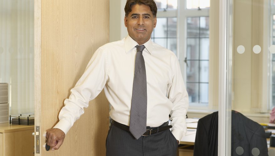 Indian businessman standing in doorway