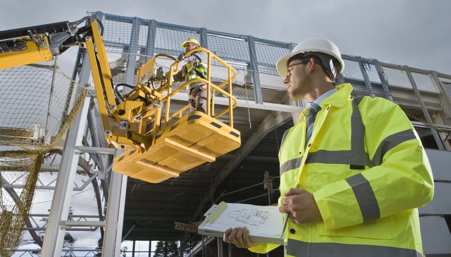 Photo Credit: Jupiterimages/BananaStock/Getty Images Construction worker with crane