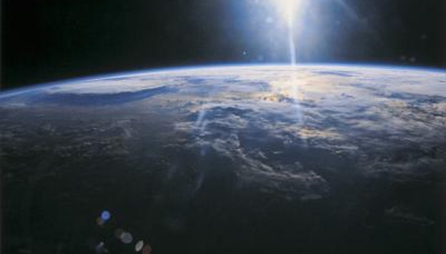 Photo Credit: Stockbyte/Stockbyte/Getty Images The rotation of the Earth shrouds half of the planet in darkness at all times.