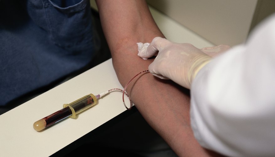 Person having blood drawn Person having blood drawn