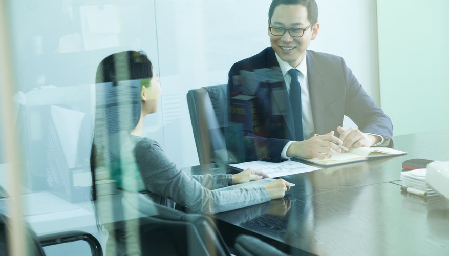 Colleagues Meeting in Conference Room, Shot Through Glass