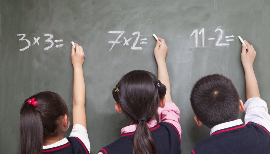 Young students are solving math problems. Young students are solving math problems.