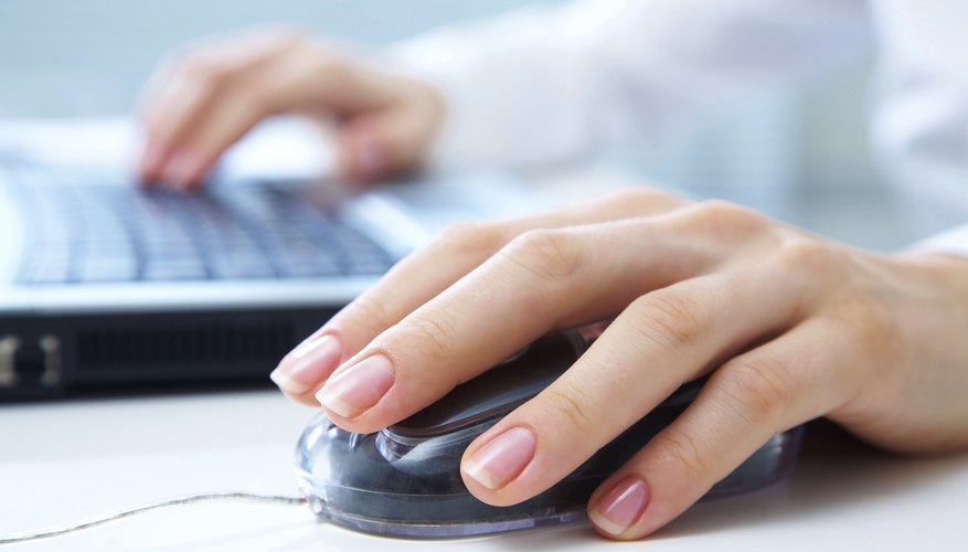 hands on computer mouse and keyboard