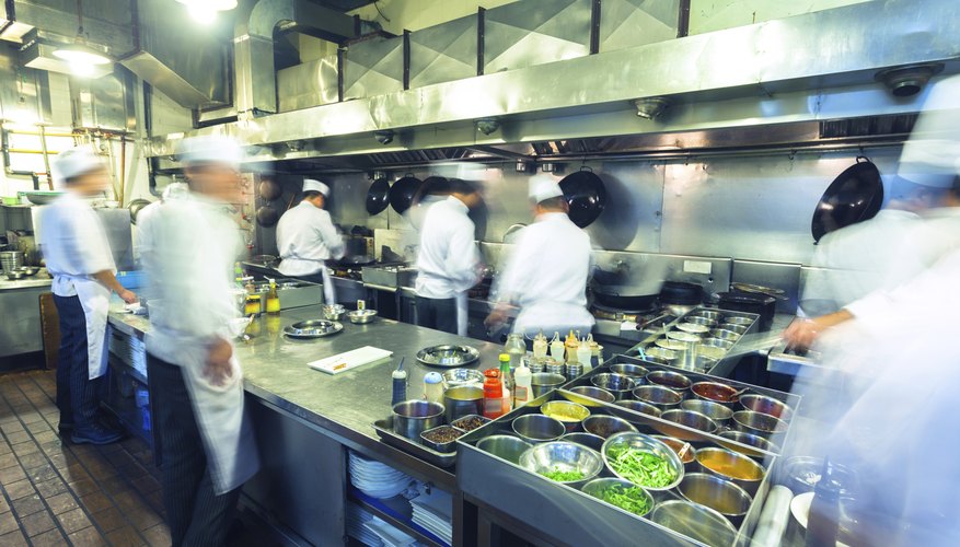 Photo Credit: wx-bradwang/iStock/Getty Images Chefs at work in a busy kitchen.