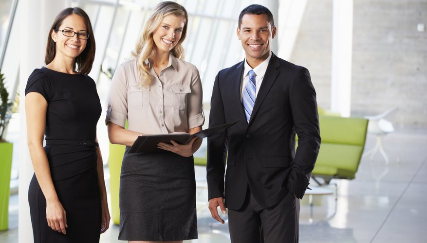 Businesspeople Having Informal Meeting In Modern Office
