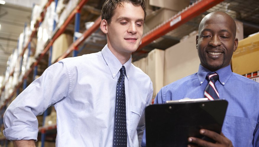 Photo Credit: monkeybusinessimages/iStock/Getty Images Manager with staff member in warehouse