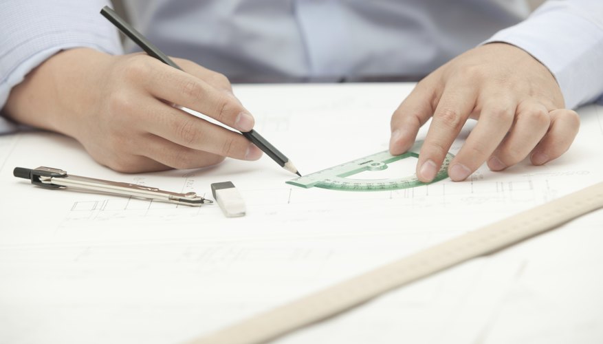 Photo Credit: Lord_Ghost/iStock/Getty Images A close-up of an architect using a protractor at his desk.