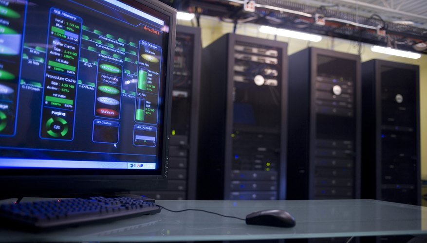 Close-up of a computer monitor in front of network servers
