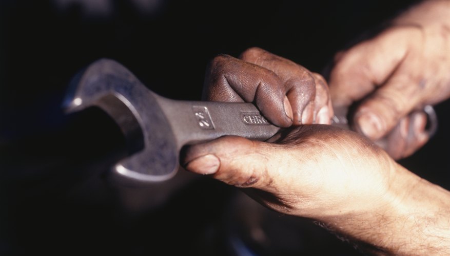 Man holding wrench, Close-up of hands