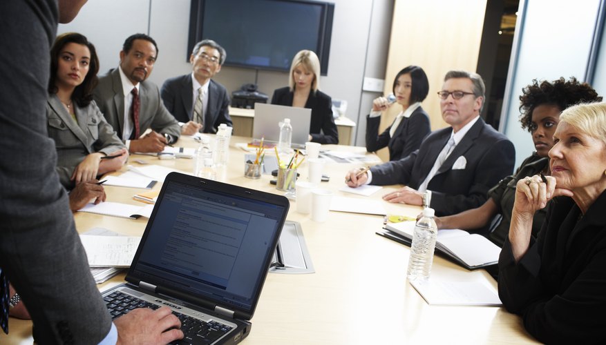 Businessman using laptop computer in meeting