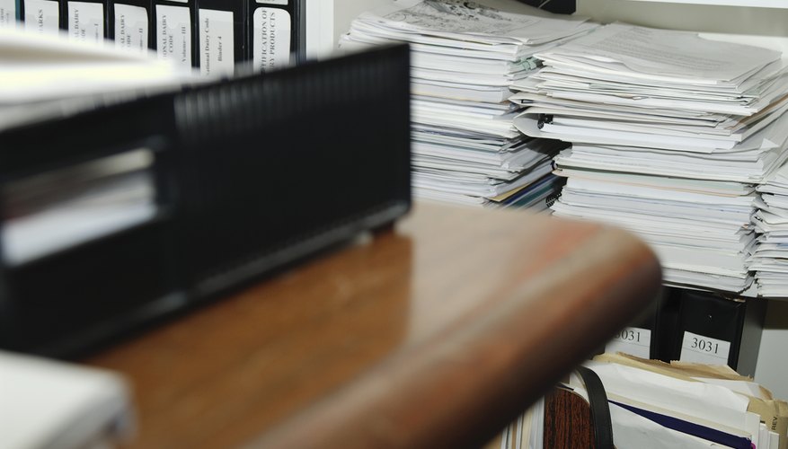 Piles of documents in office