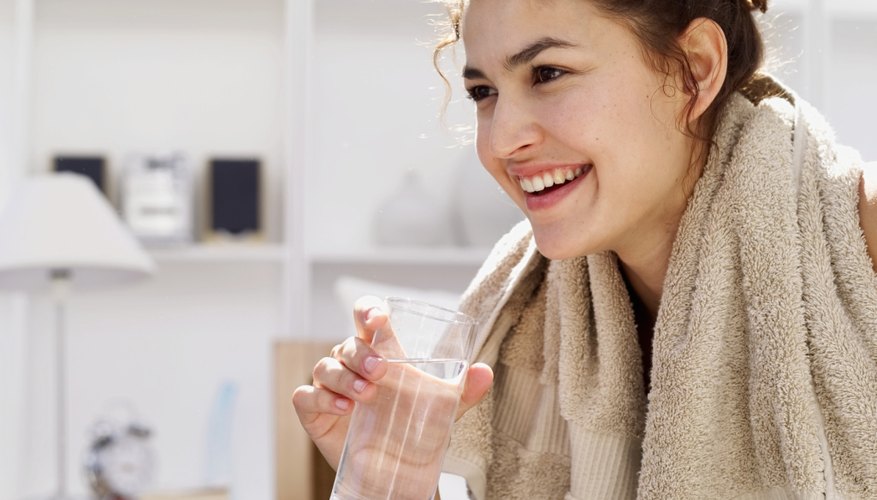 Photo Credit: Stockbyte/Stockbyte/Getty Images Use a glass of water to rinse your teeth after brushing.