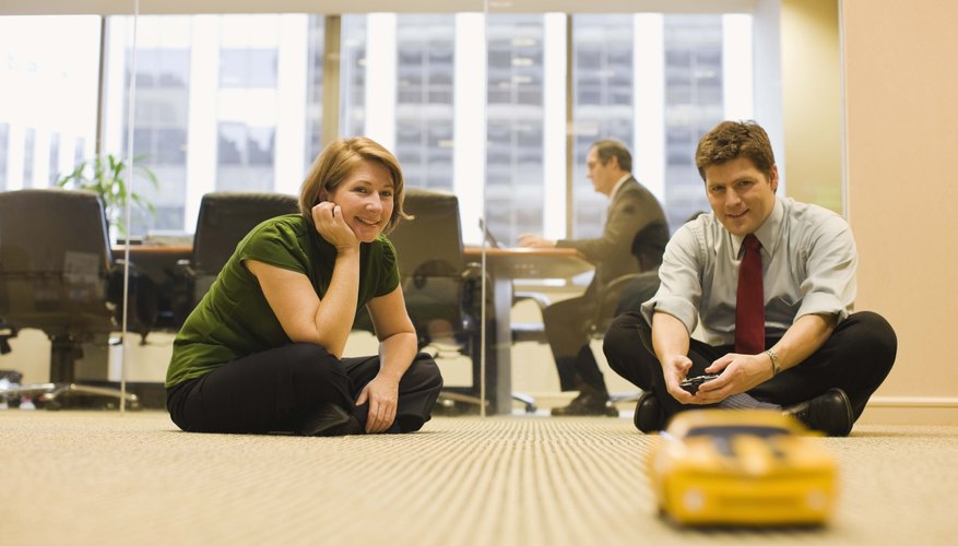 Businesspeople with a toy car