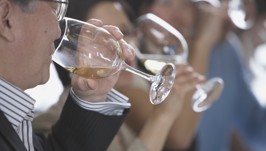 Group of seniors drinking white wine. Group of seniors drinking white wine.