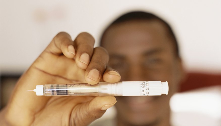 Young man holding insulin for Diabetes Young man holding insulin for Diabetes