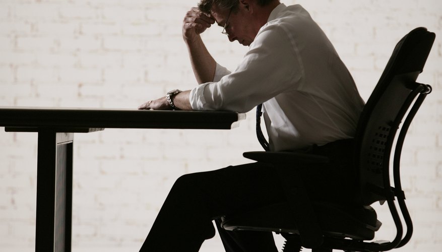 Defeated businessman at desk