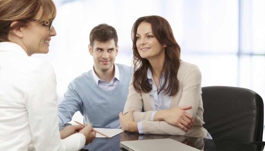 Young couple discussing financial plan with consultat