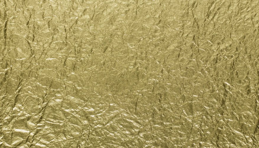 Utiliza calor para transferir una imagen de aluminio dorado a un objeto.