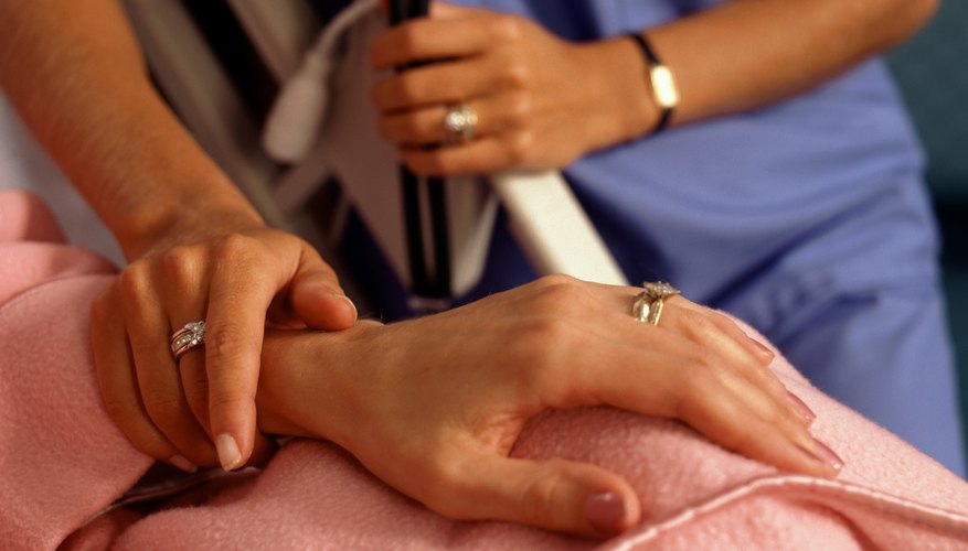 Doctor holding patients hand Doctor holding patients hand