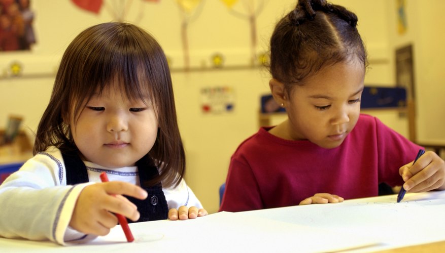 Children colouring at daycare. Children colouring at daycare.