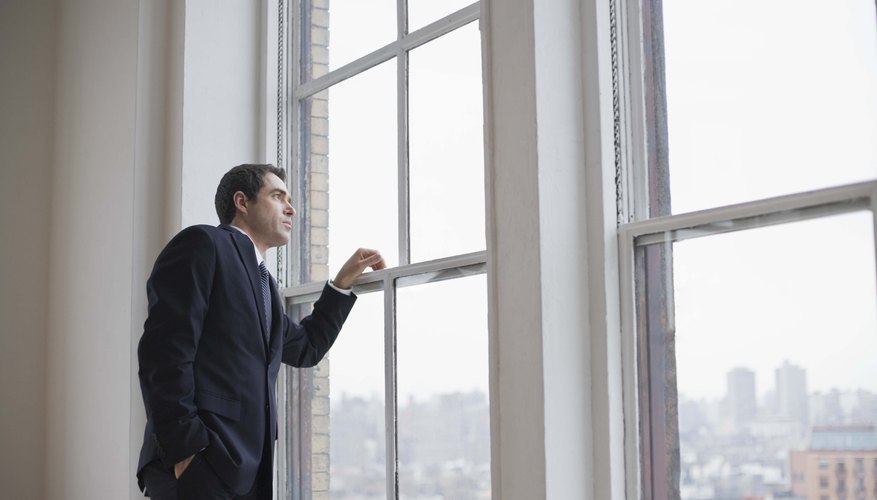 Businessman looking out of window