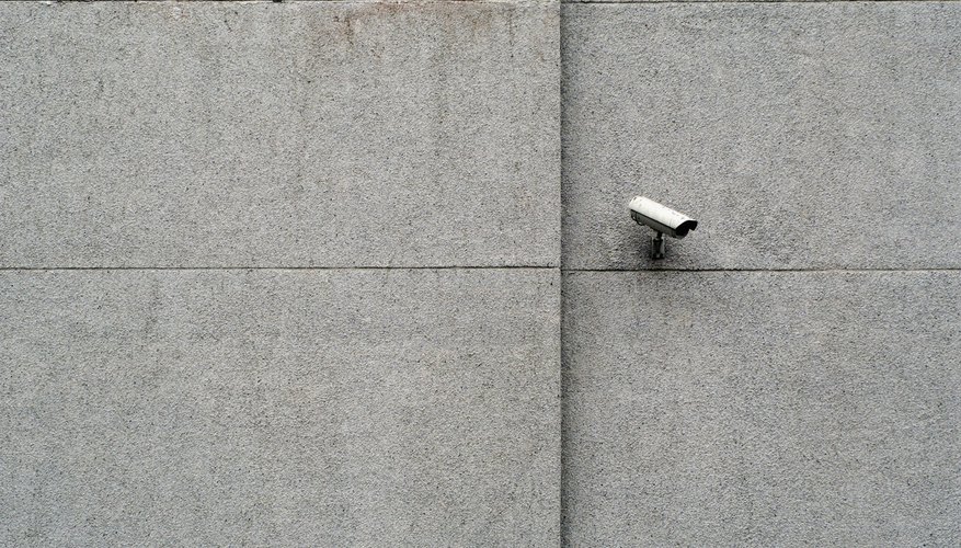 Close-up of a security camera on a wall