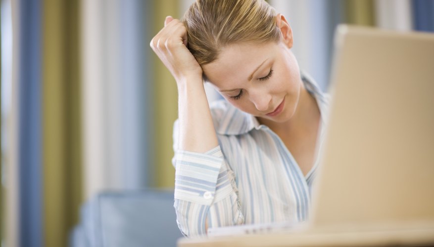 Woman leaning head on hand Woman leaning head on hand