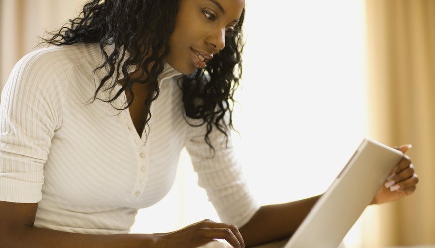 Woman looking at laptop Woman looking at laptop