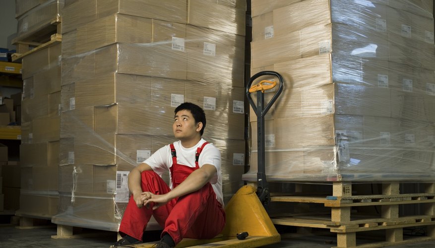 Worker sitting in warehouse