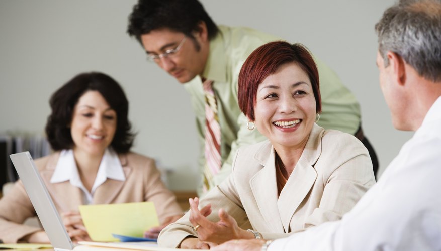 Businesspeople working at conference table