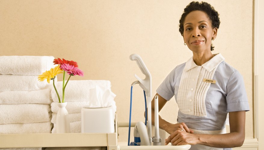 Hotel maid with cart