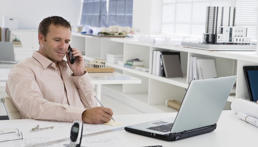 Photo Credit: Jupiterimages/Pixland/Getty Images exempt employee analyzing business data