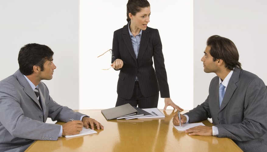 Businesswoman in meeting with colleagues
