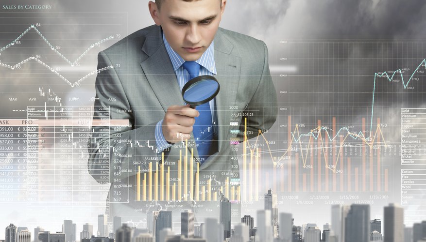 Man looking in magnifier