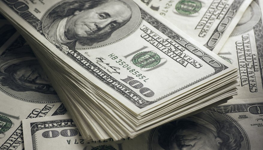 Piles of hundred dollar bills.