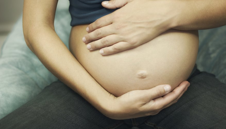Closeup of pregnant woman's stomach Closeup of pregnant woman's stomach
