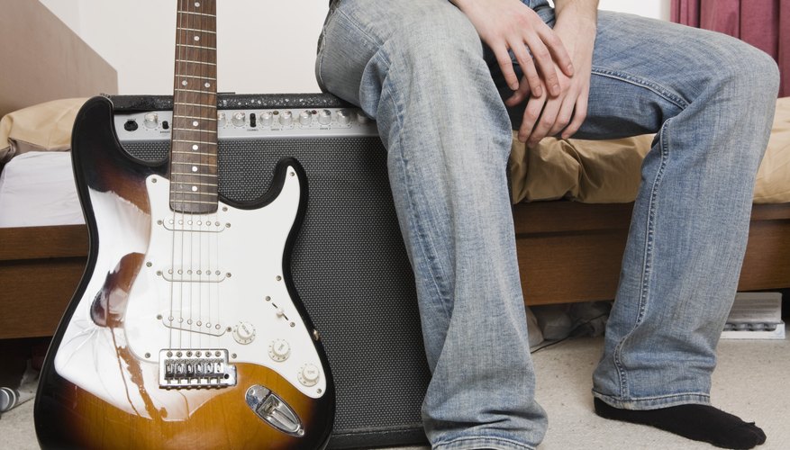 Man with guitar and amp