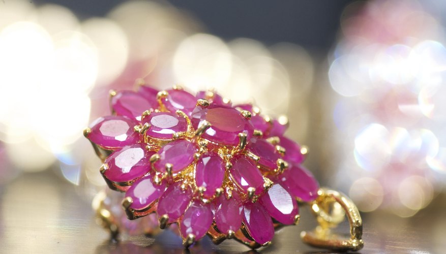 Photo Credit: DelafrayeNicolas/iStock/Getty Images Gold pendant filled with rubies.