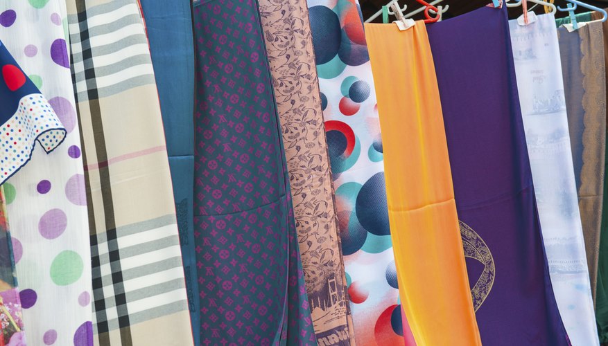 Photo Credit: PaulVinten/iStock/Getty Images A stall selling scarves