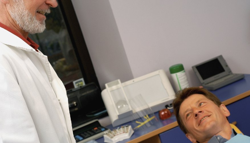 Dentist and patient Dentist and patient