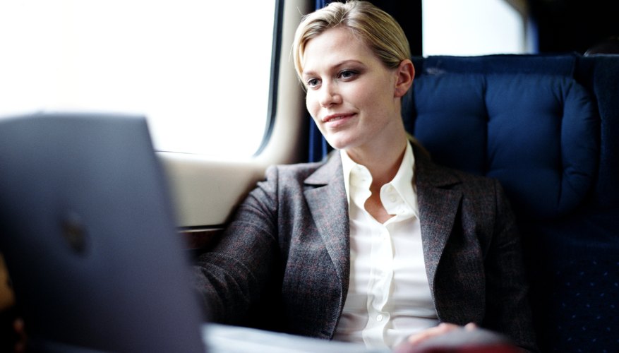 Photo Credit: Digital Vision/Digital Vision/Getty Images Woman looking at laptop